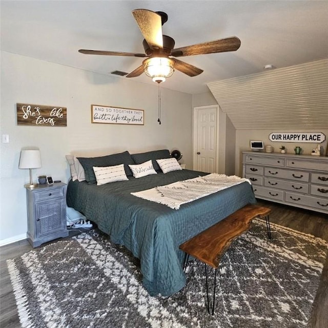 bedroom with a ceiling fan, baseboards, visible vents, and wood finished floors