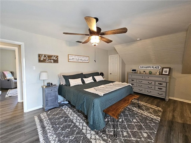 bedroom featuring ceiling fan, wood finished floors, and baseboards