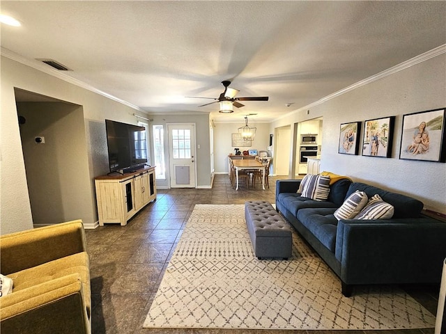 living room featuring ornamental molding, visible vents, and baseboards