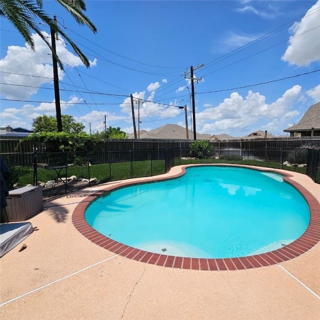 view of pool featuring a patio area, a fenced backyard, and a fenced in pool