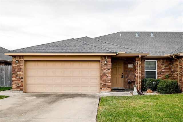 ranch-style house featuring a garage