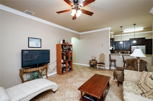 living room featuring ceiling fan, light tile patterned floors, and crown molding