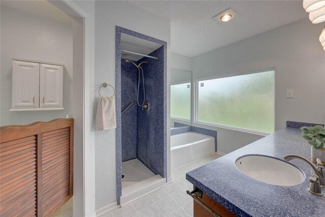 4621 Weiskopf, Corpus Christi, TX 78413 - full bath with vanity, a stall shower, a garden tub, and a closet