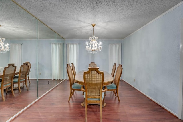 4621 Weiskopf, Corpus Christi, TX 78413 - dining space featuring a chandelier, a textured ceiling, wood finished floors, and ornamental molding