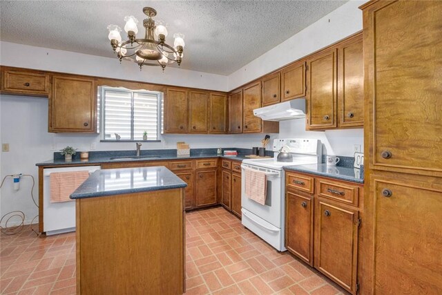4621 Weiskopf, Corpus Christi, TX 78413 - kitchen featuring white appliances, brown cabinetry, a kitchen island, a chandelier, and under cabinet range hood