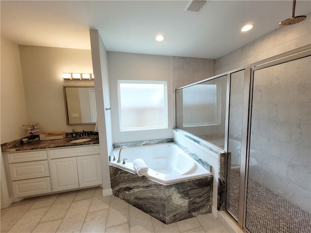 6721 Sharks Ct, Corpus Christi, TX 78414 - full bath featuring a stall shower, a garden tub, vanity, and recessed lighting