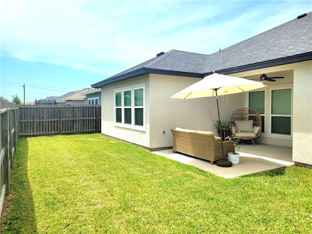 6721 Sharks Ct, Corpus Christi, TX 78414 - back of house with stucco siding, a patio, a shingled roof, and a ceiling fan