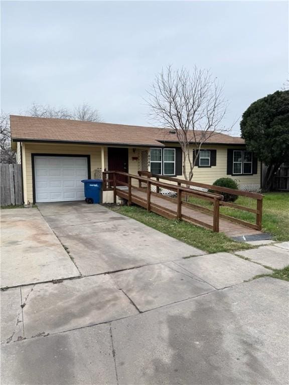 single story home featuring a garage