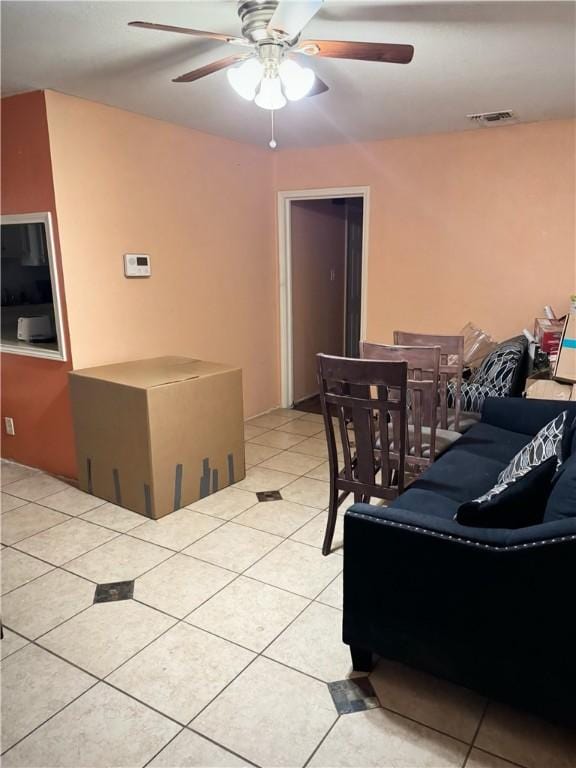 interior space with ceiling fan and light tile patterned floors