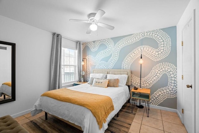 bedroom with baseboards, a ceiling fan, and tile patterned floors