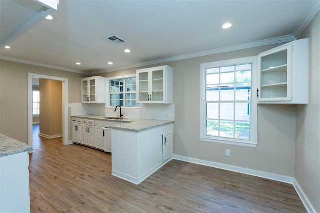 kitchen featuring ornamental molding, visible vents, and white cabinetry