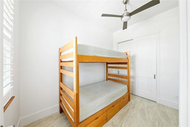 bedroom featuring ceiling fan and a closet