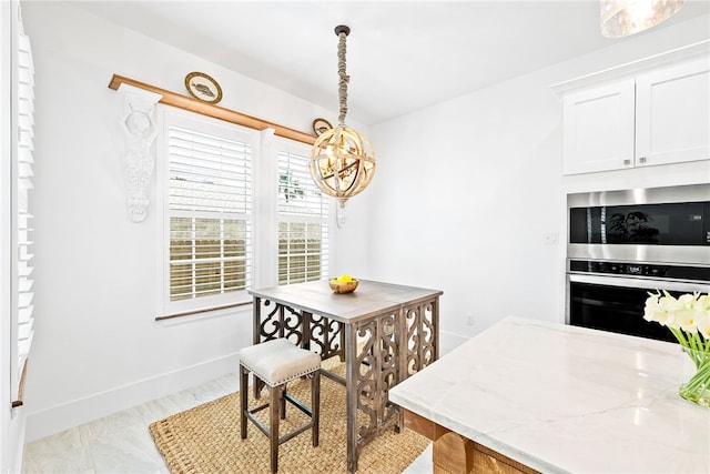 dining space featuring a chandelier