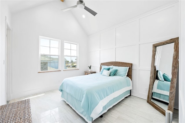 bedroom featuring ceiling fan and high vaulted ceiling