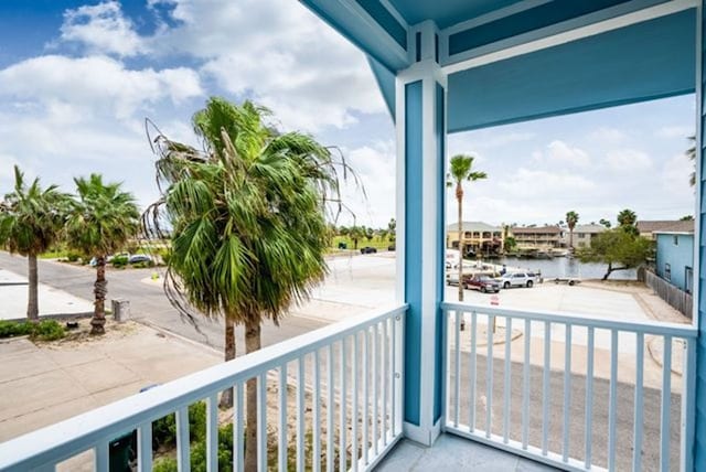 balcony featuring a water view