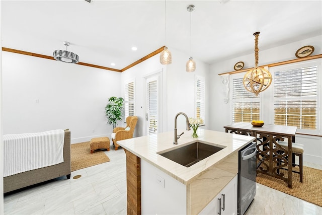 kitchen with sink, hanging light fixtures, light stone counters, stainless steel dishwasher, and an island with sink