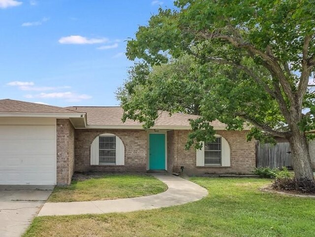 2108 Matagorda Dr, Portland, TX 78374 - single story home featuring an attached garage, brick siding, concrete driveway, and roof with shingles
