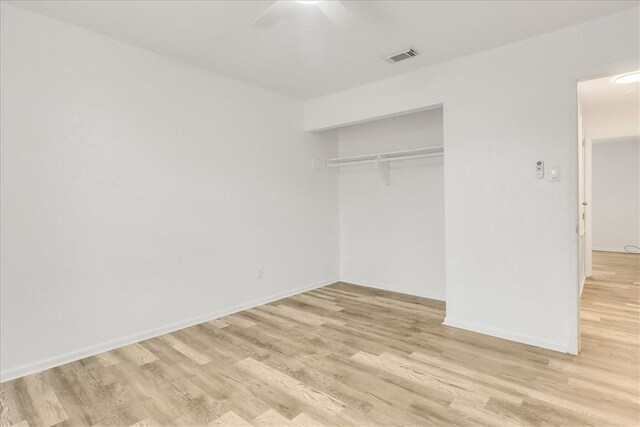 2108 Matagorda Dr, Portland, TX 78374 - unfurnished bedroom featuring light wood finished floors, a closet, and a ceiling fan