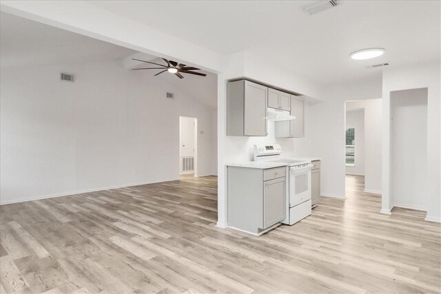 2108 Matagorda Dr, Portland, TX 78374 - kitchen featuring white electric range, gray cabinets, under cabinet range hood, light wood-style floors, and vaulted ceiling