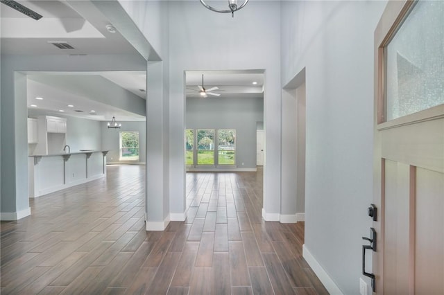 407 Main, Odem, TX 78370 - entryway featuring ceiling fan, dark wood-style floors, recessed lighting, and a chandelier
