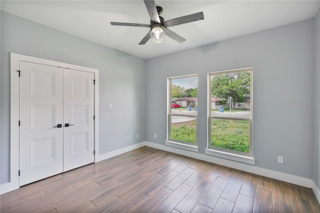 407 Main, Odem, TX 78370 - spare room featuring wood finished floors and ceiling fan