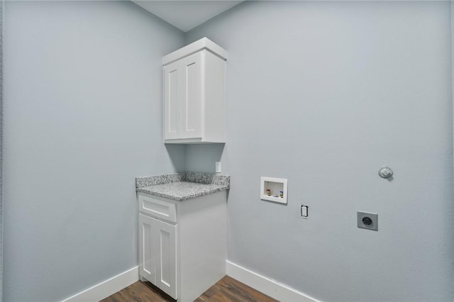 407 Main, Odem, TX 78370 - washroom with electric dryer hookup, hookup for a washing machine, dark wood-type flooring, and cabinet space