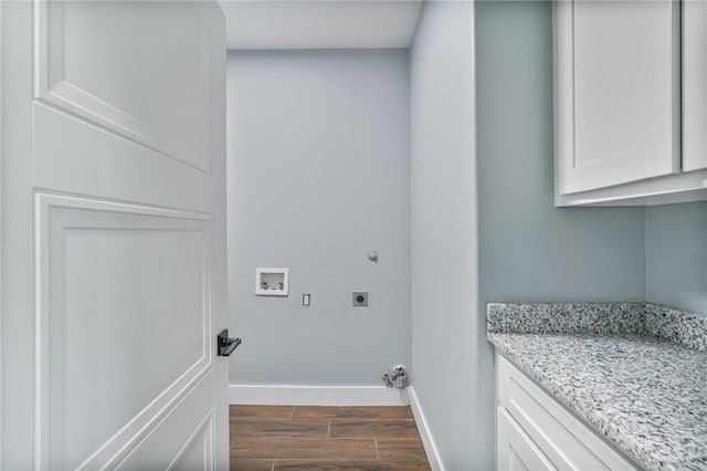 407 Main, Odem, TX 78370 - laundry room with electric dryer hookup, dark wood-type flooring, washer hookup, and cabinet space