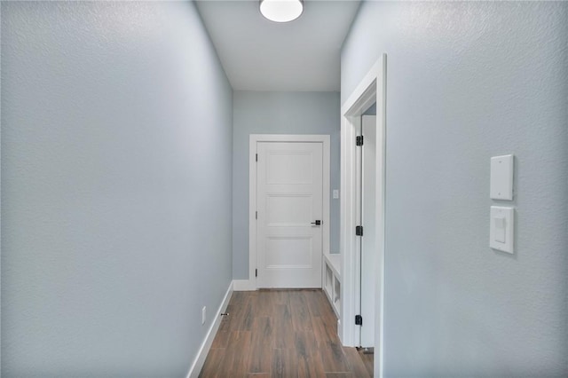 407 Main, Odem, TX 78370 - hallway featuring dark wood-style floors and baseboards