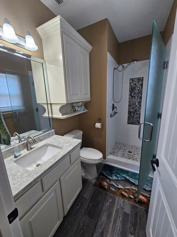 15333 Beaufort Ct, Corpus Christi, TX 78418 - full bath featuring a stall shower, wood finished floors, and vanity