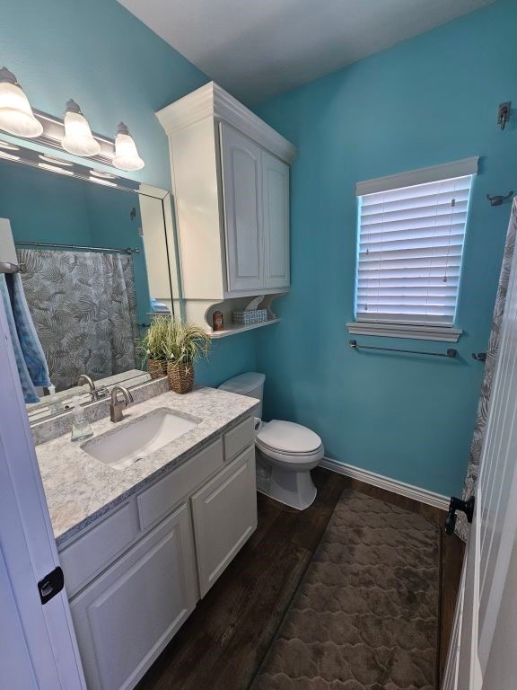 15333 Beaufort Ct, Corpus Christi, TX 78418 - bathroom with wood finished floors, vanity, and a shower with curtain