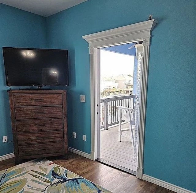 15333 Beaufort Ct, Corpus Christi, TX 78418 - bedroom with access to exterior and wood finished floors