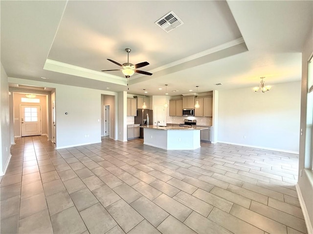 1030 Ocean Breeze St, Portland, TX 78374 - unfurnished living room with a tray ceiling, a chandelier, light tile patterned flooring, ceiling fan, and ornamental molding