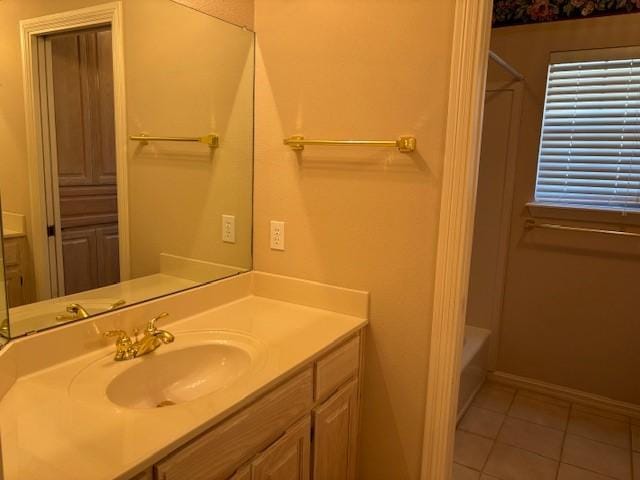 bathroom with tile patterned floors and vanity