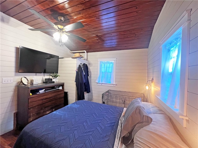 bedroom featuring hardwood / wood-style flooring, vaulted ceiling, wooden ceiling, and ceiling fan