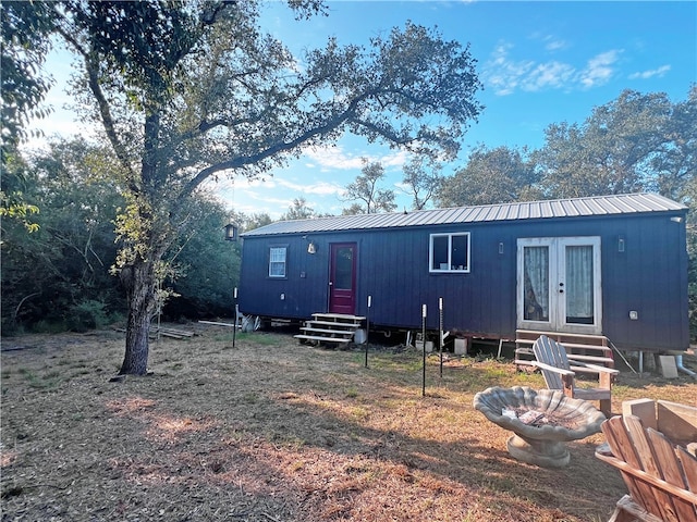 back of house featuring french doors