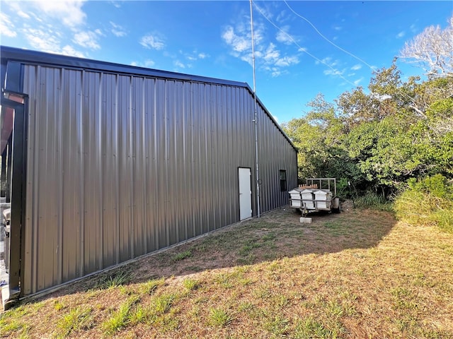 view of home's exterior with a yard