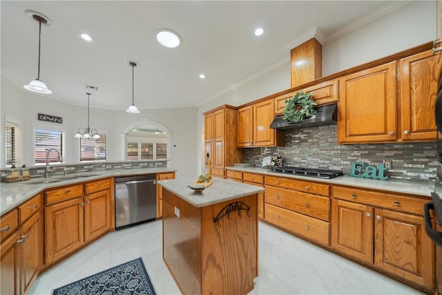 kitchen with a center island, brown cabinets, stainless steel appliances, a sink, and extractor fan