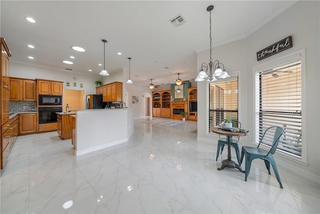 kitchen featuring visible vents, decorative backsplash, open floor plan, black appliances, and pendant lighting