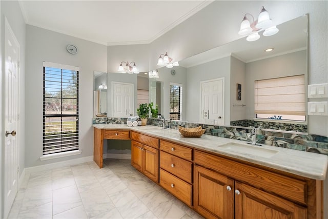 bathroom featuring ornamental molding, marble finish floor, double vanity, and a sink