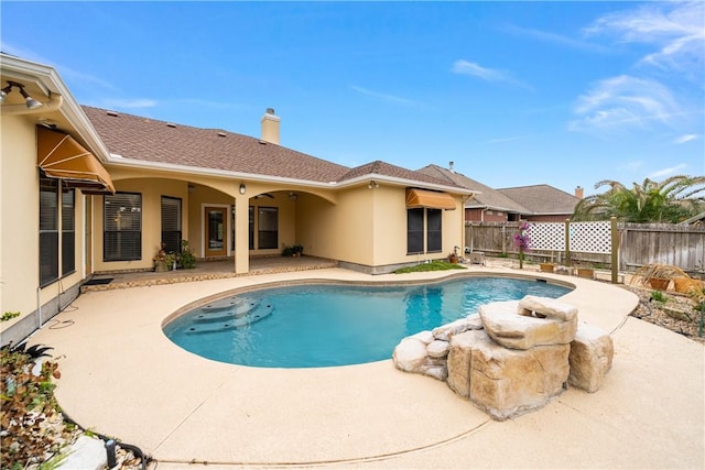 view of swimming pool featuring a patio area, a fenced backyard, and a fenced in pool