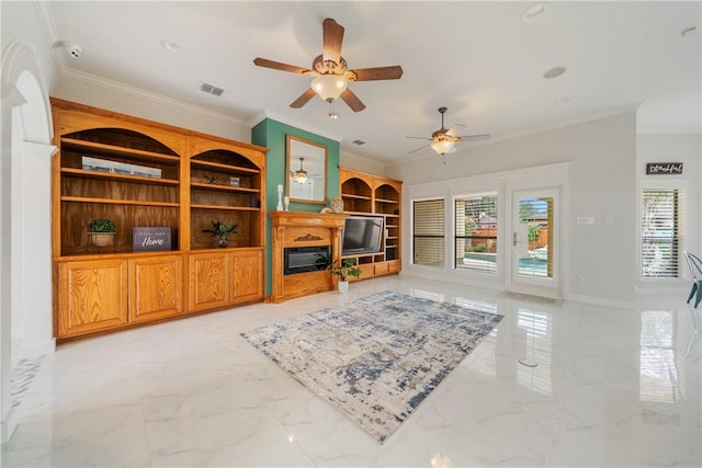 living area featuring visible vents, baseboards, marble finish floor, ornamental molding, and a glass covered fireplace