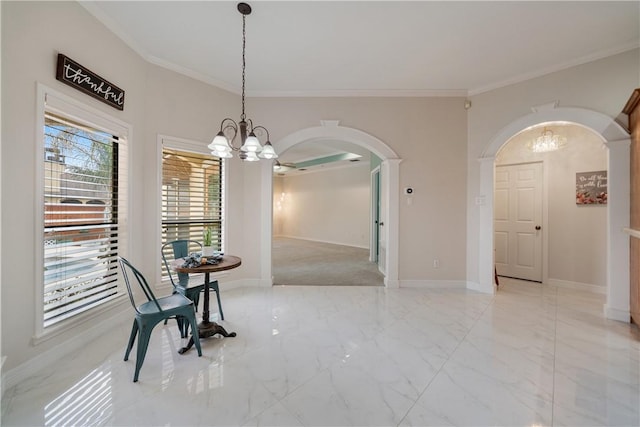 dining room with arched walkways, a notable chandelier, baseboards, marble finish floor, and crown molding