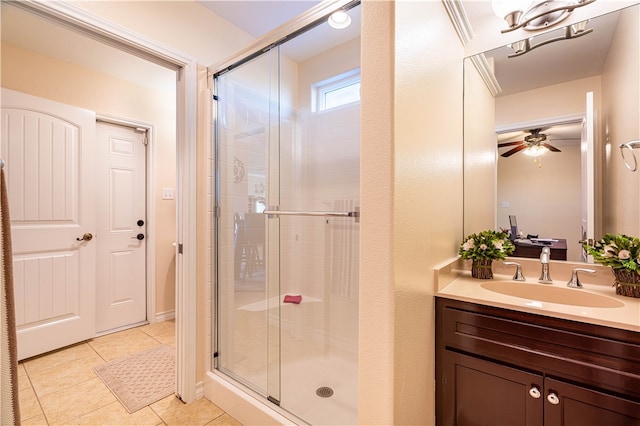 bathroom with vanity, tile patterned flooring, a shower with door, and ceiling fan