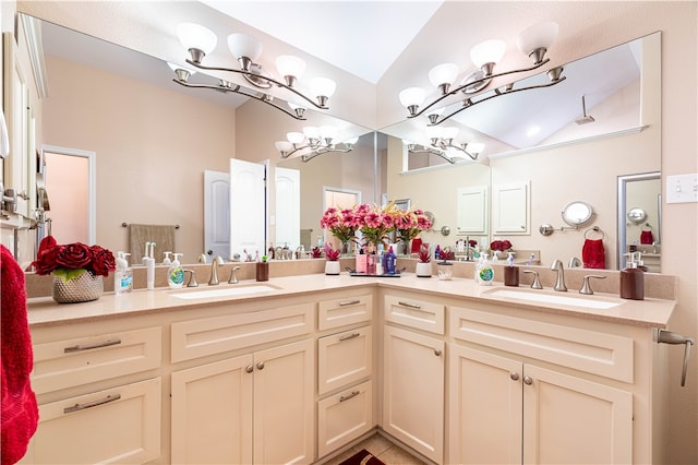 bathroom featuring vanity and vaulted ceiling