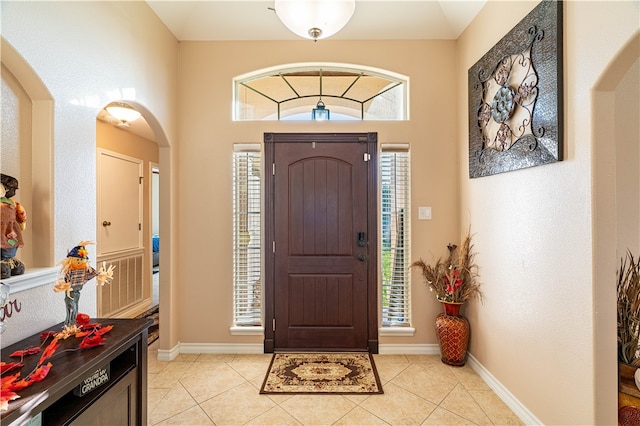 tiled entryway featuring plenty of natural light