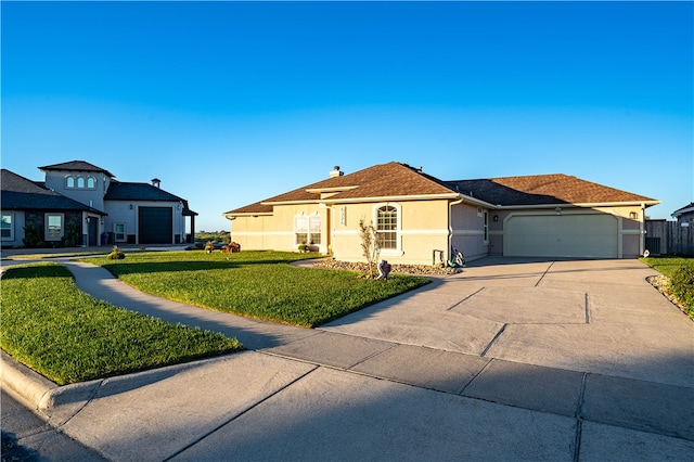 view of front of property featuring a garage and a front yard