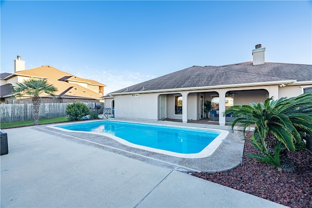 view of swimming pool with a patio area