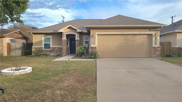 view of front of property with a garage and a front lawn