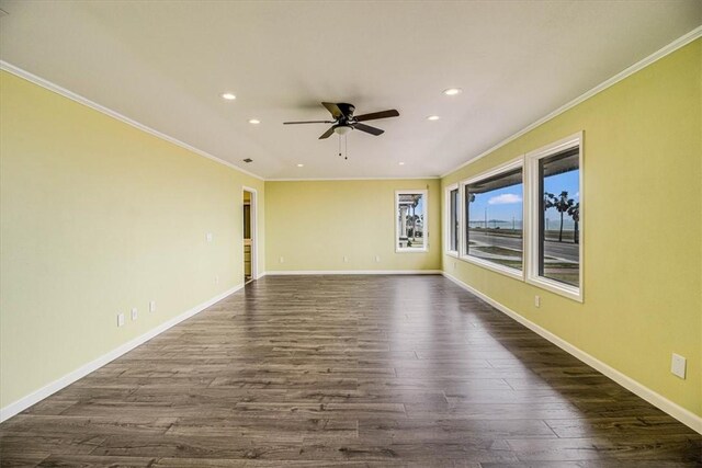 empty room with baseboards and dark wood-style flooring