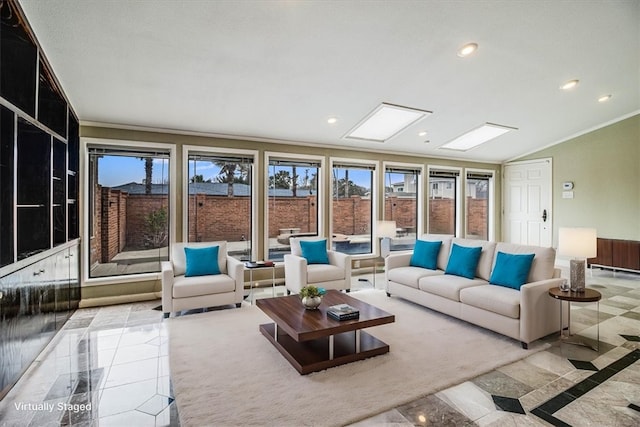 sunroom featuring vaulted ceiling with skylight